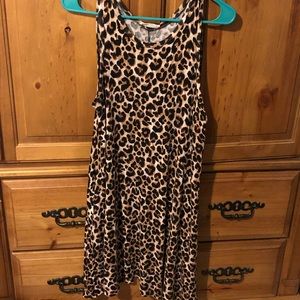 Sleeveless knee length leopard dress with pockets.